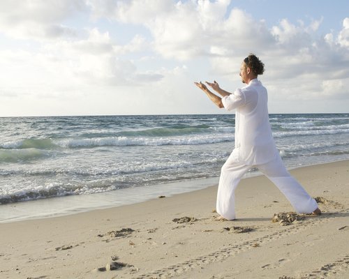 Woman practicing yoga outdoors in nature